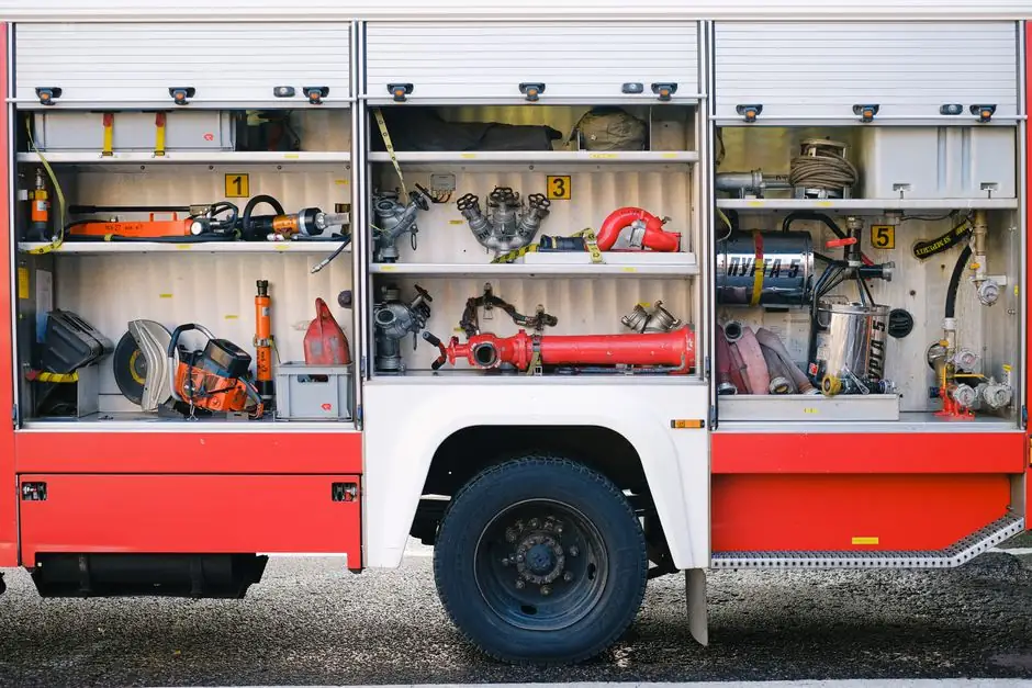 Close-up view of fire truck compartments filled with essential firefighting tools and equipment.